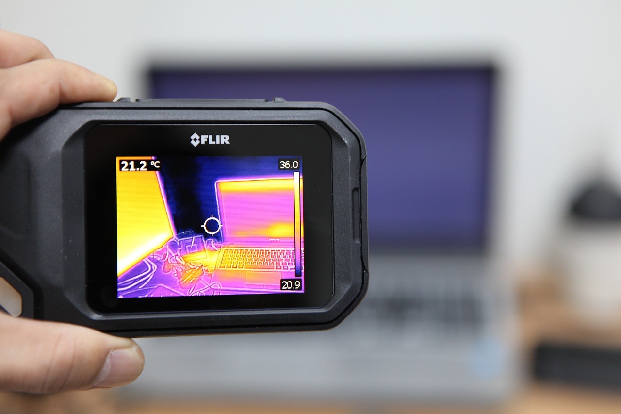 Thermal camera showing an image of a laptop on a table. 