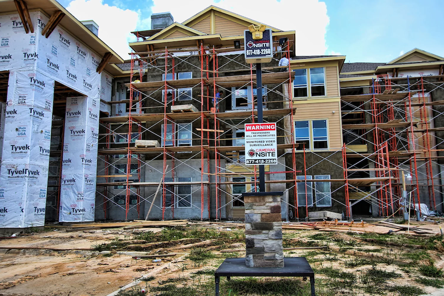 A construction site with a Cameras Onsite surveillance camera. 