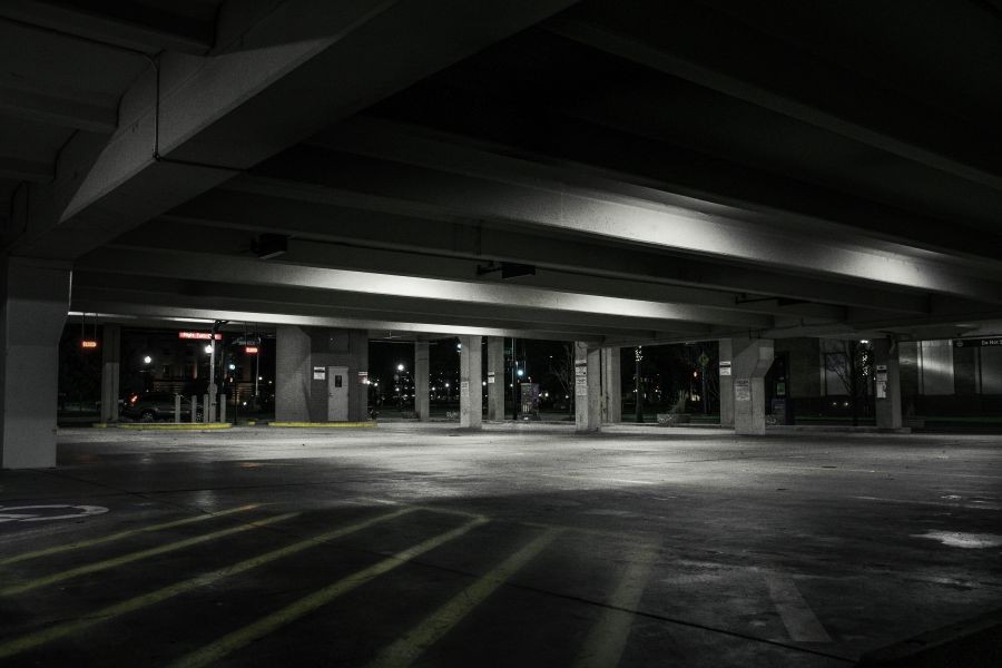An underground parking lot at night.
