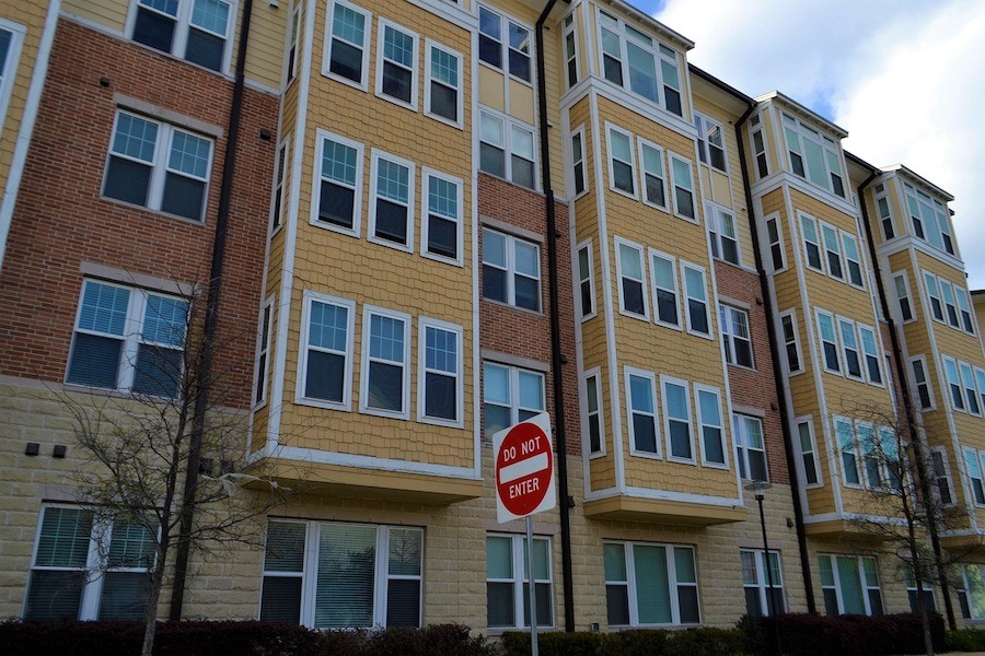 A street view of a typical modern apartment building complex.