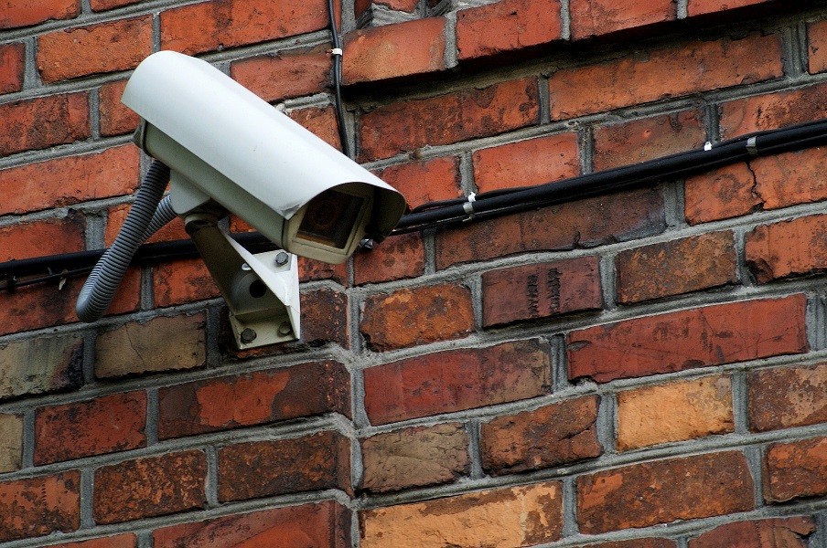 Security camera attached to a brick building